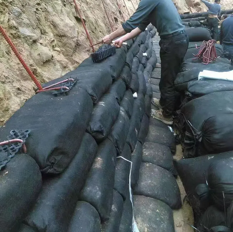 โรงงานอุตสาหกรรม 40*80cm Geotextile Geobag สําหรับการป้องกันหินทางด่วน Geotextile Geobag การปลูกป่า การปลูกหญ้า การควบคุมน้ําท่วม Geotextile Geobag 7