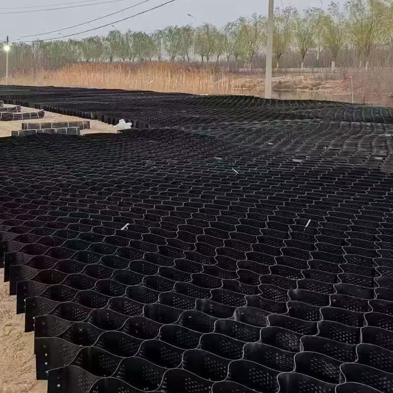 แผ่นพลาสติก HDPE รังผึ้งแบบมีพื้นผิวและเจาะรูสำหรับเสริมความมั่นคงในการก่อสร้างถนน